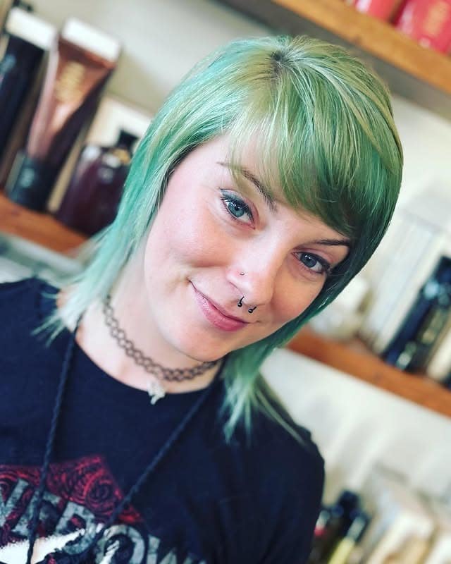 3. Short Razor Cut with Piecey Bangs in Emerald Green - Short Layered Haircuts with Bangs