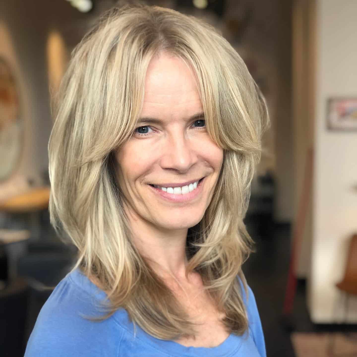 9. Long Layered Shag with Full Fringe in Sandy Blonde - Short Layered Haircuts with Bangs