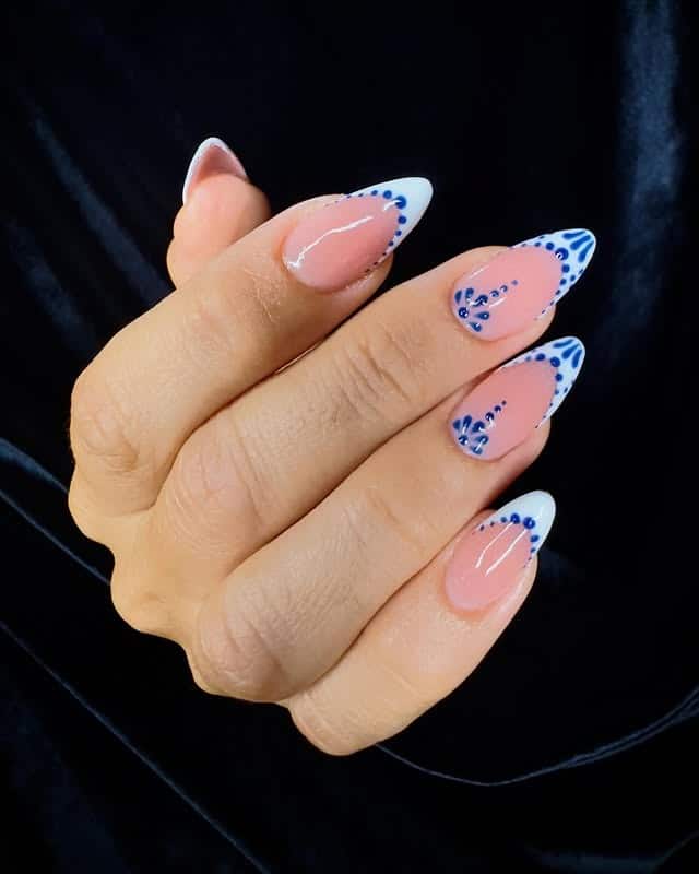 7. Blue Floral French Almond Nails - white and blue nail ideas
