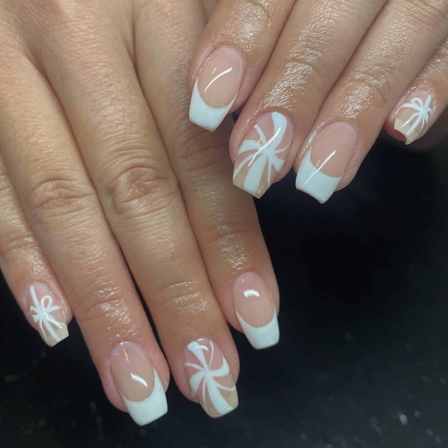 6. Classic White French with Snowflake Art - white christmas nail ideas