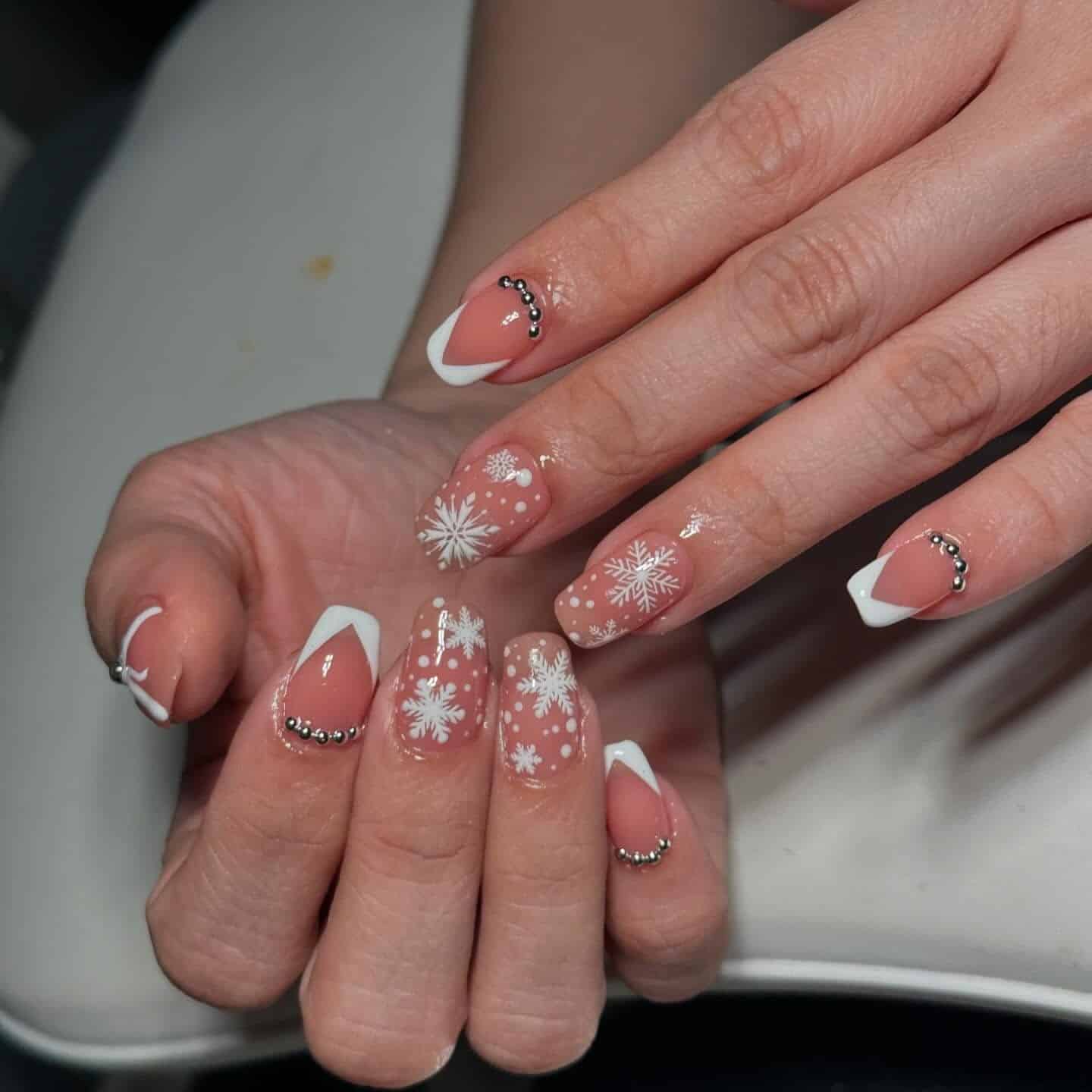 8. Snowflake French with Pearl Accents - white christmas nail ideas