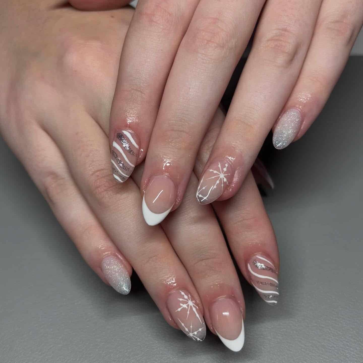 12. White French Snowflake Almond Nails - white christmas nail ideas