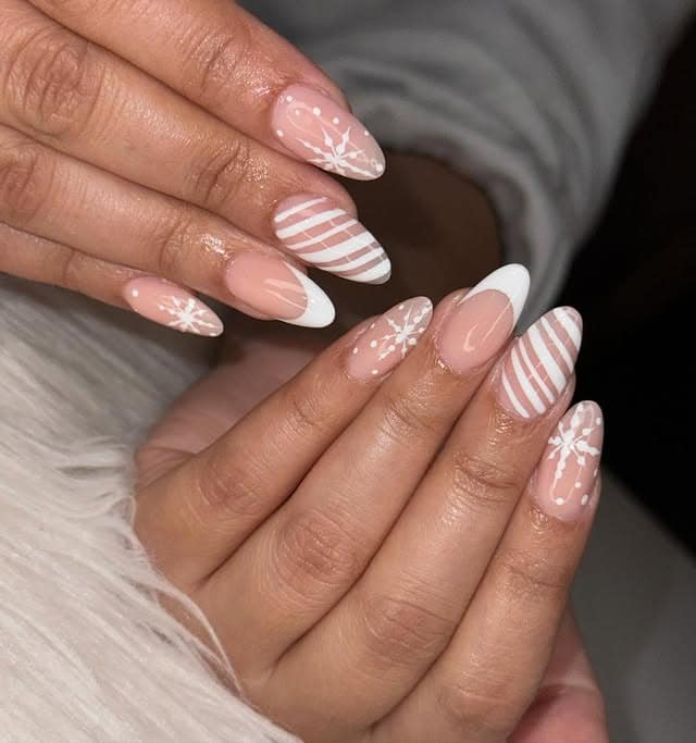 13. Blush Stripe and Snowflake Almond Nails - white christmas nail ideas
