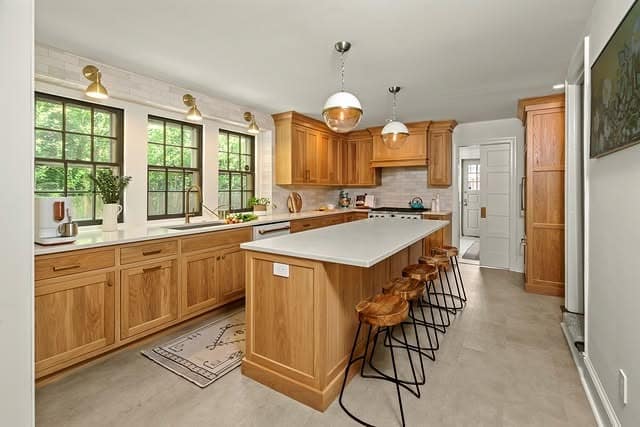 2. Classic Oak Cabinetry with Warm White Accents - oak cabinets kitchen ideas
