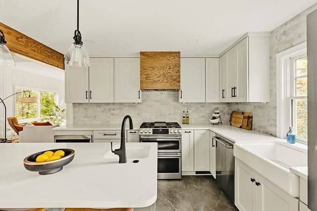 11. Soft White Kitchen with Oak Accents and Matte Black Details - oak cabinets kitchen ideas