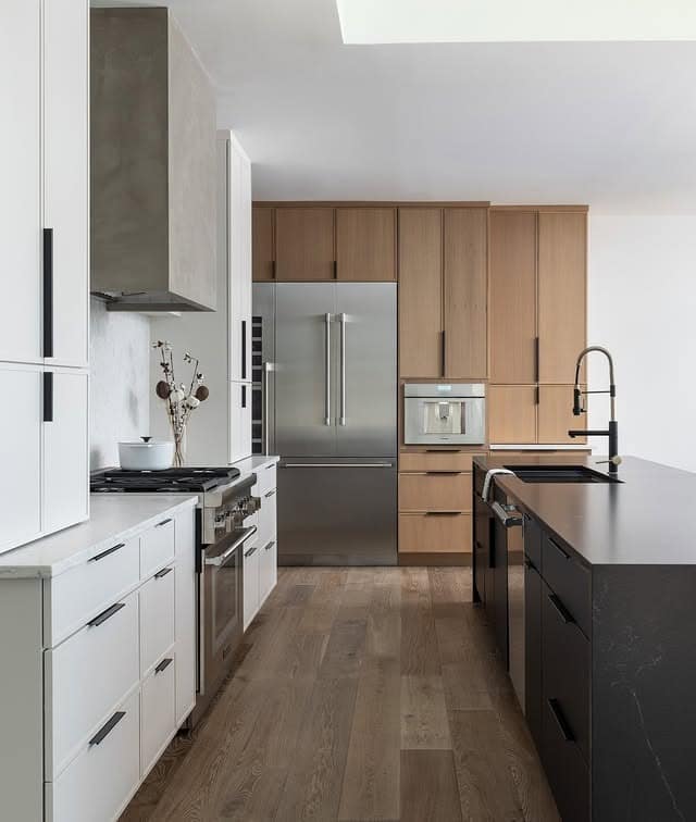 14. Two-Tone Oak and White Kitchen with Black Island Contrast - oak cabinets kitchen ideas