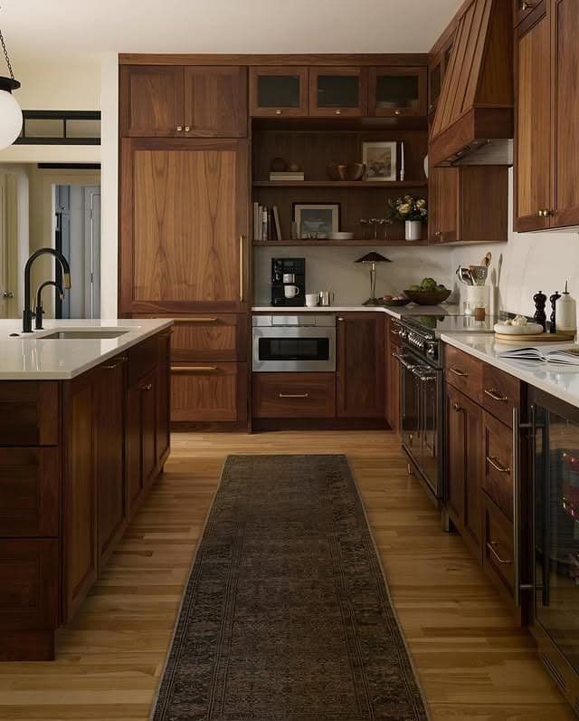 20. Rich Walnut-Style Oak Kitchen with Warm Wood Flooring - oak cabinets kitchen ideas