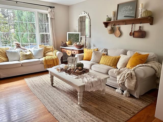 2. Cozy Cottage Living Room with Warm Cream and Mustard Accents - vintage living room ideas