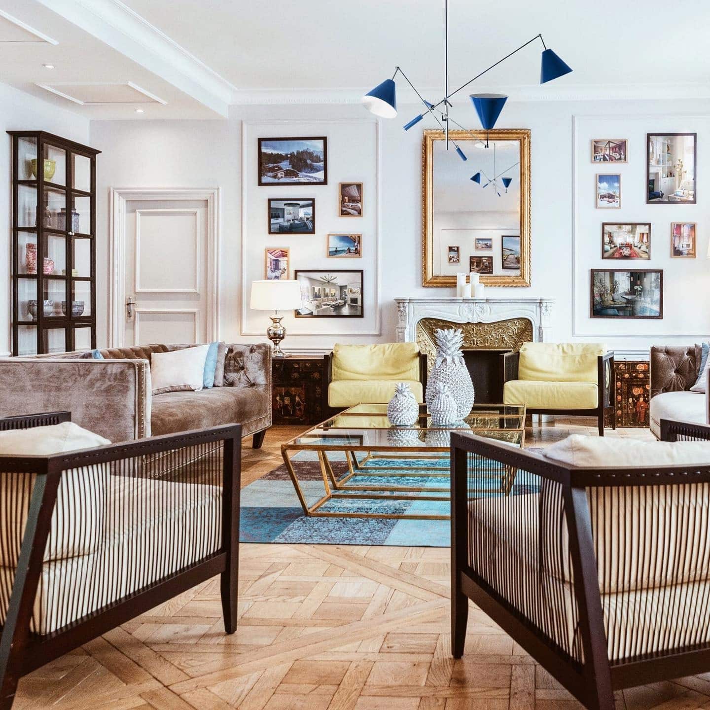 10. Refined Vintage Living Room with Blue, Gold, and Wood Tones - vintage living room ideas