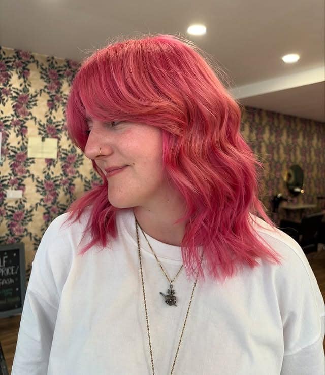 6. Raspberry Pink Wavy Lob - Pink Hair Color