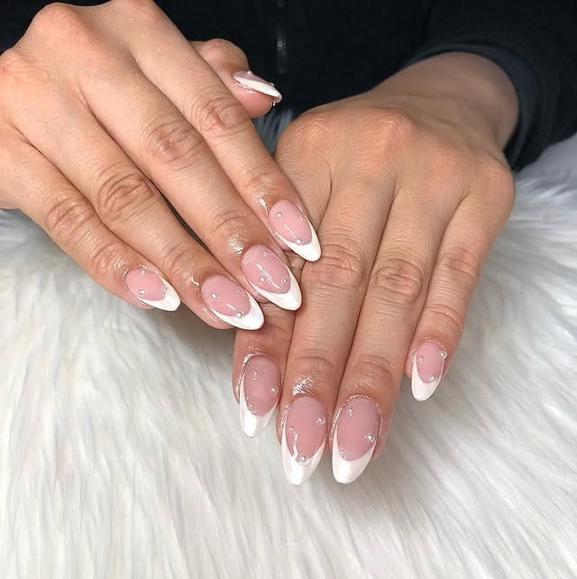 2. White Chrome French Almond Nails on Sheer Nude Base - white chrome nail ideas