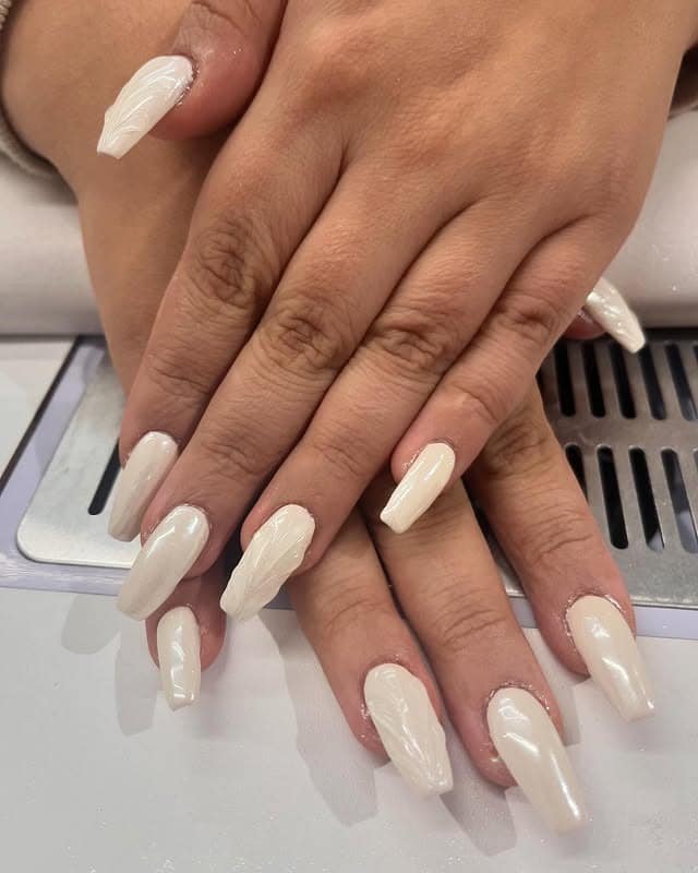 3. Milky White Chrome Coffin Nails with Sculpted Texture - white chrome nail ideas