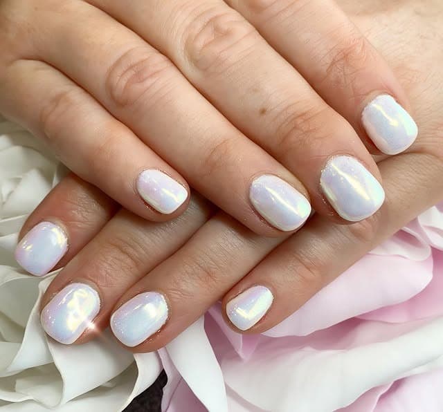 11. Short Oval White Chrome Nails with Pearl Finish - white chrome nail ideas