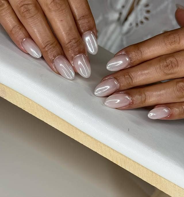 14. Sheer Nude Almond Nails with White Chrome Overlay - white chrome nail ideas