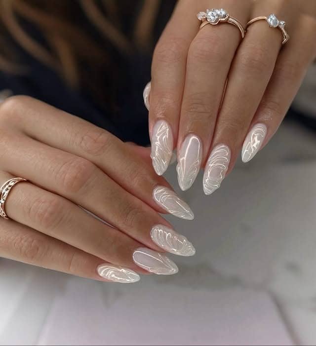 20. Sculpted White Chrome Almond Nails with Line Art - white chrome nail ideas
