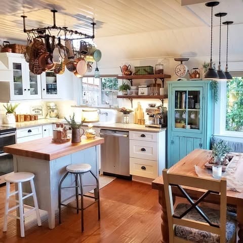 5. Cozy Farmhouse Kitchen with Open Storage and Vintage Touches - farmhouse kitchen ideas