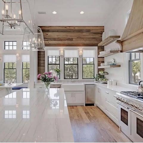 13. Modern White Farmhouse Kitchen with Wood Accent Wall - farmhouse kitchen ideas