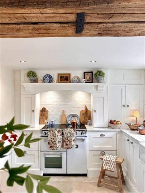 14. Classic White Farmhouse Kitchen with Vintage Character - farmhouse kitchen ideas