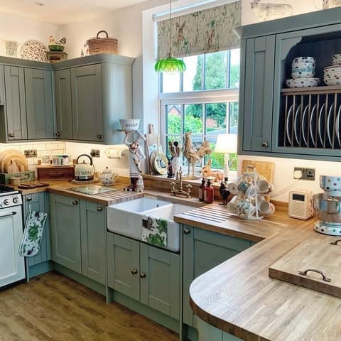 17. Soft Green Farmhouse Kitchen with Wood Counters - farmhouse kitchen ideas