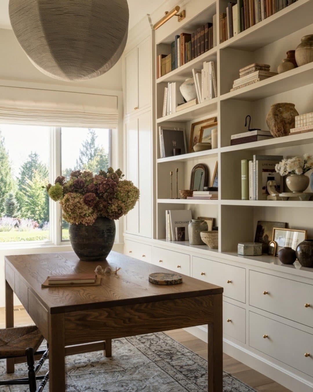 14. Classic Library Office with Cream Cabinetry and Natural Wood - simple home office ideas