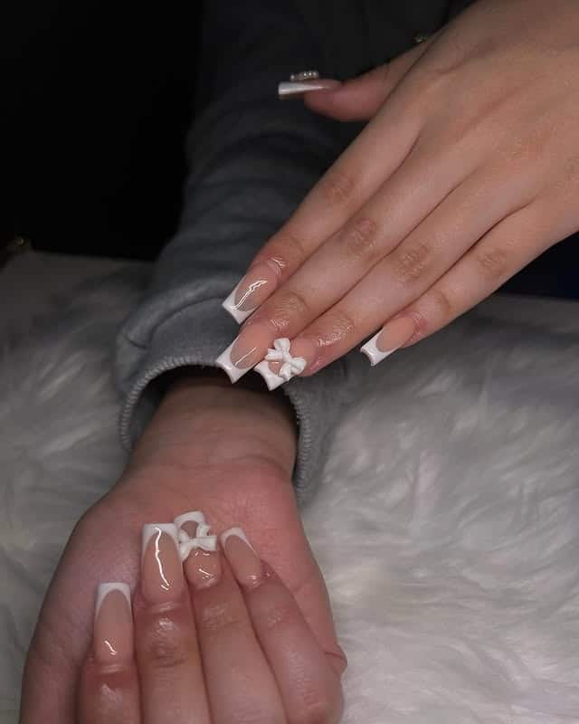 1. Classic White French with 3D Bow Accent - white short nail ideas