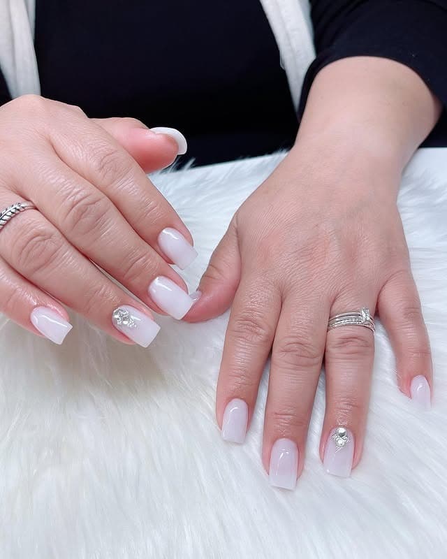 11. Milky White Short Square Nails with Crystal Accent - white short nail ideas