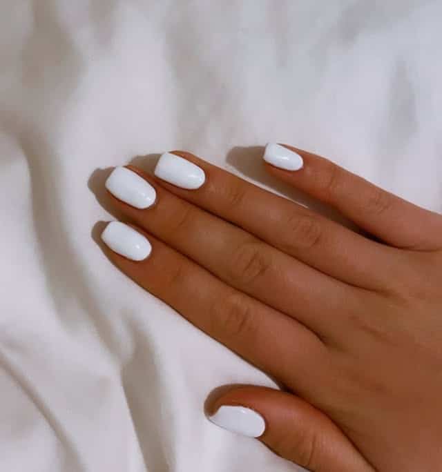 15. Classic White Short Oval Nails - white short nail ideas