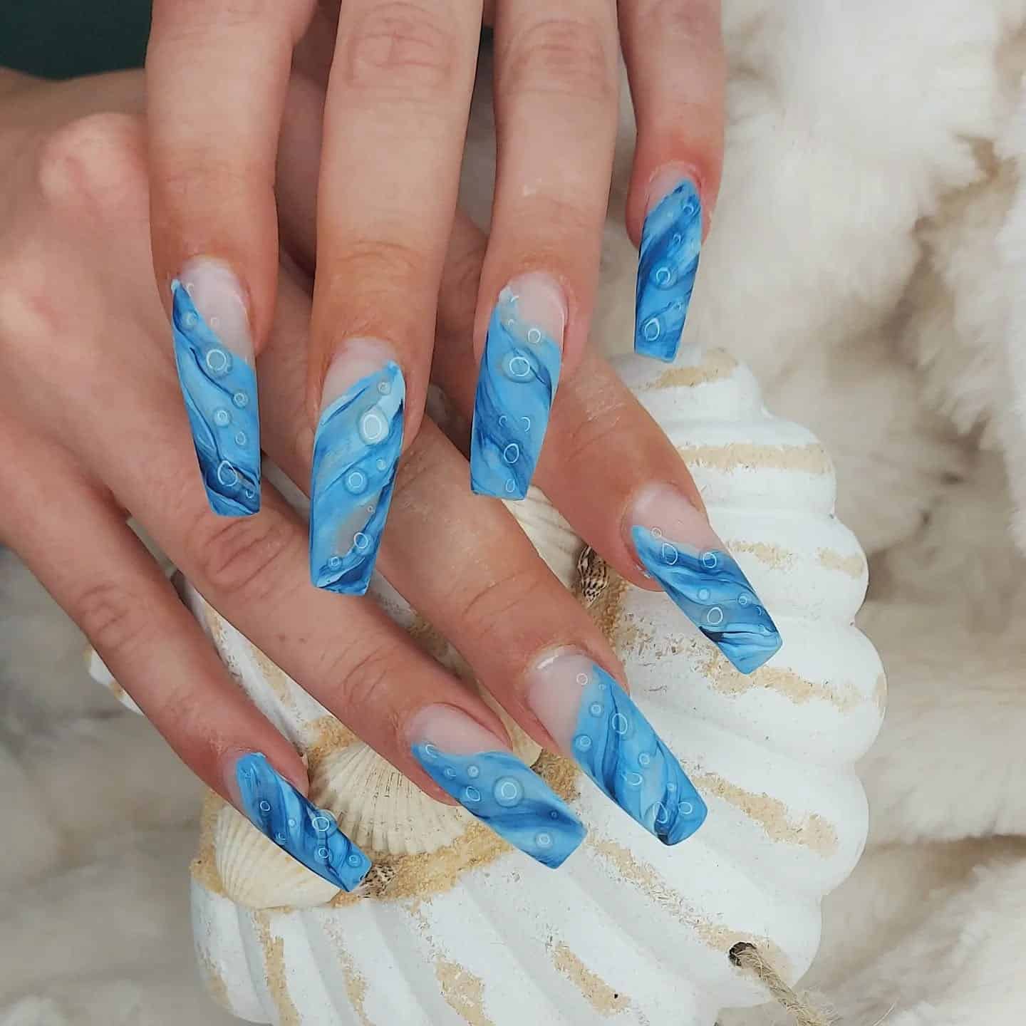 6. Aqua Blue Water Marble Coffin Nails - aqua blue nail ideas