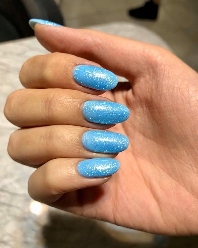 13. Sparkle Aqua Blue Almond Gel Nails - aqua blue nail ideas