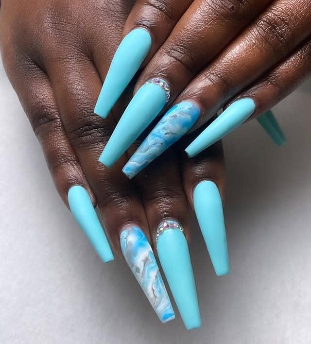 15. Matte Aqua Blue XL Coffin Nails with Marble Accent - aqua blue nail ideas