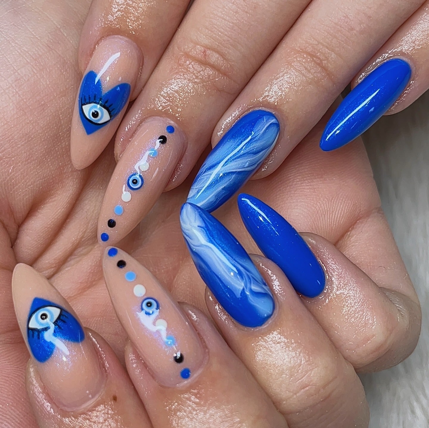 20. Deep Aqua Blue Almond Nails with Graphic Art - aqua blue nail ideas