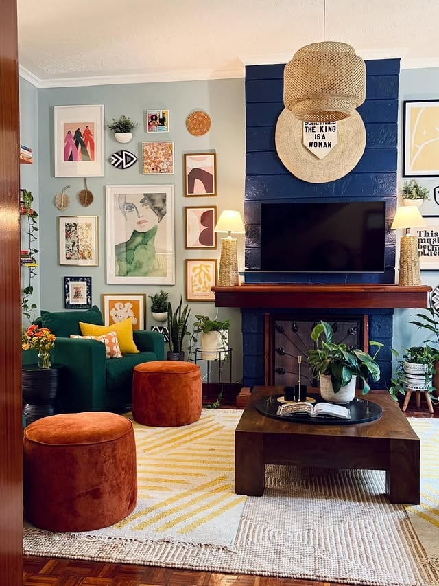 19. Eclectic Cozy Living in Deep Blue and Warm Neutrals - warm and cozy living room ideas