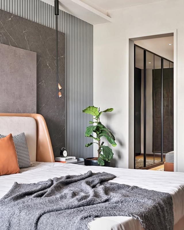 5. Textured Tan Bedroom with Sculptural Wall Paneling - tan bedroom ideas