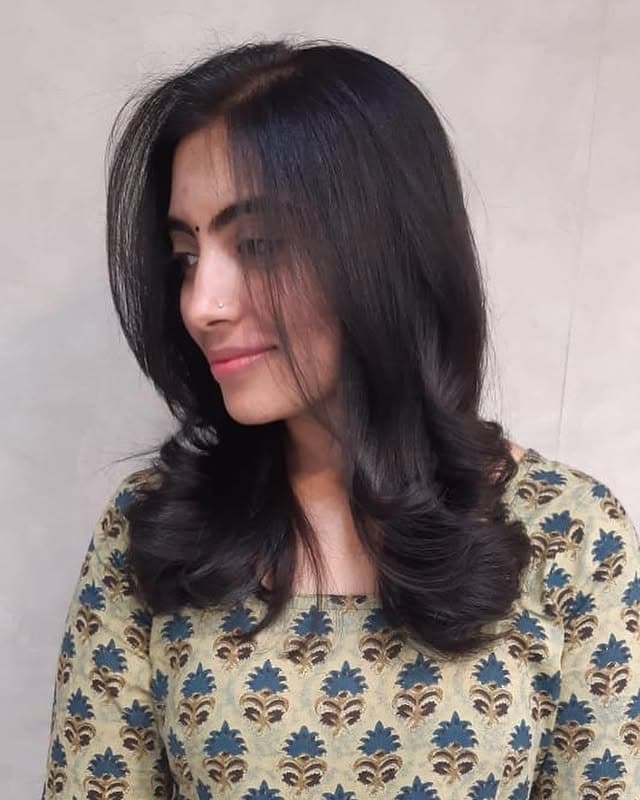 2. Feathered Layers with Deep Espresso Brown - Medium-Length Hairstyles