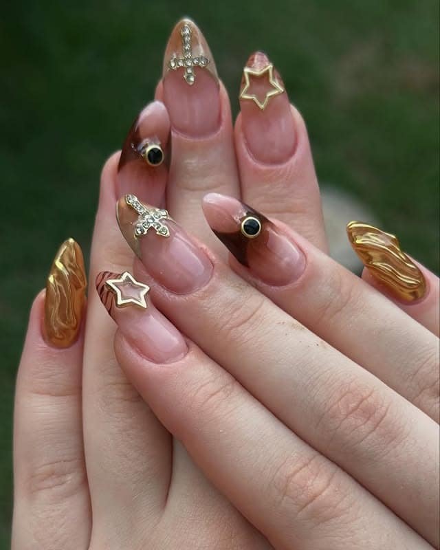 7. Sculpted Gold Charm Nails in Nude and Amber - asian nail ideas