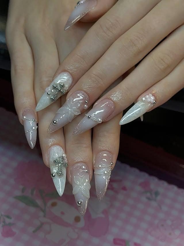 20. Sculpted Pearl Stiletto Nails in Nude and Ivory - asian nail ideas