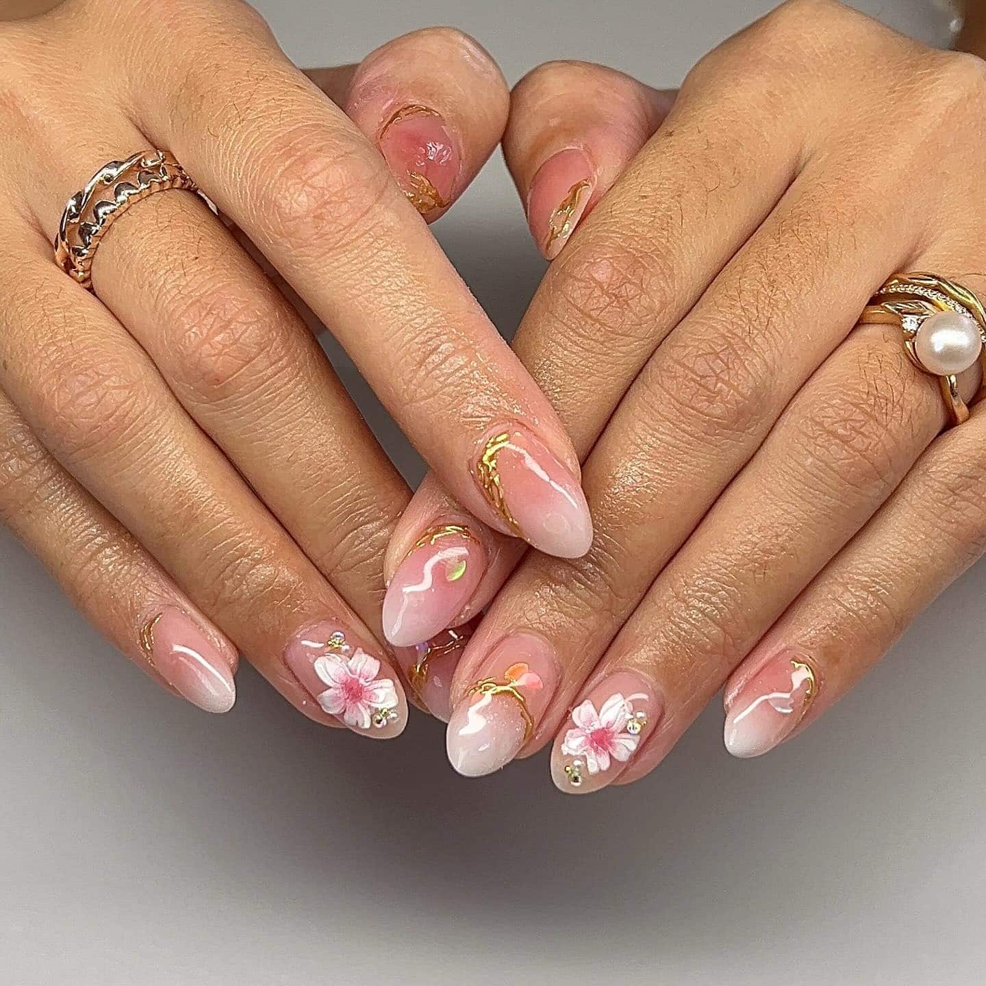 21. Soft Sakura Accent Nails in Sheer Pink and Gold - asian nail ideas