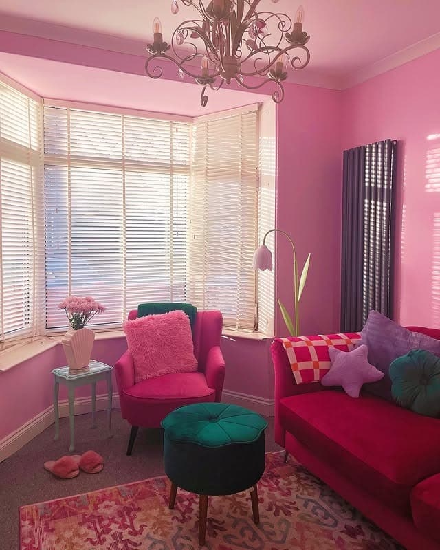 1. Playful Pink Lounge with Jewel Accents - pink living room ideas