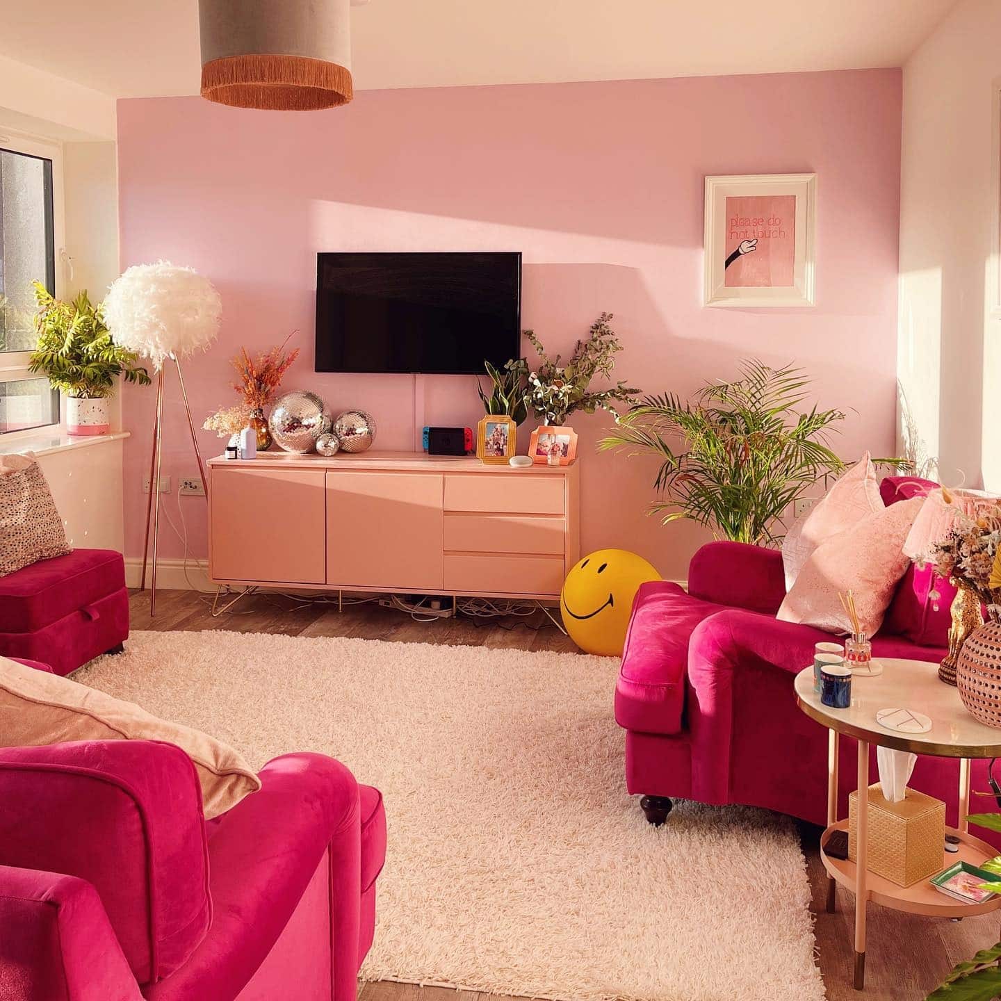 11. Blush and Raspberry Lounge with Contemporary Comfort - pink living room ideas