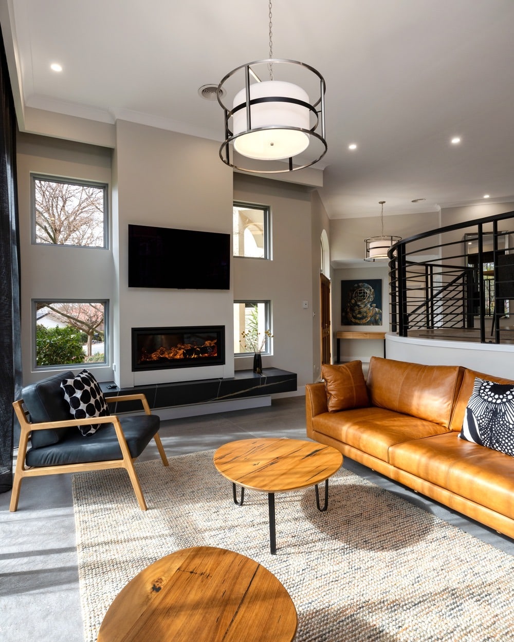 6. Modern Open-Concept Living Room in Black and Cognac - black and brown living room ideas