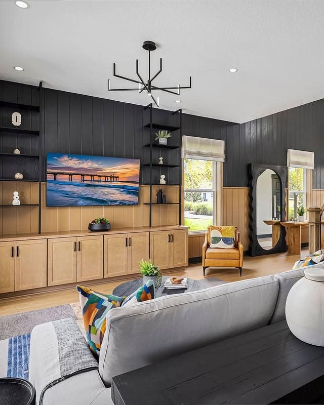 7. Two-Tone Feature Wall with Black and Light Wood - black and brown living room ideas