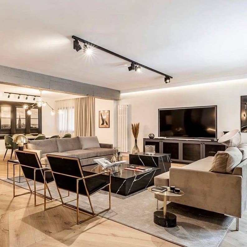 14. Open-Concept Living Room with Black Accents and Soft Brown - black and brown living room ideas