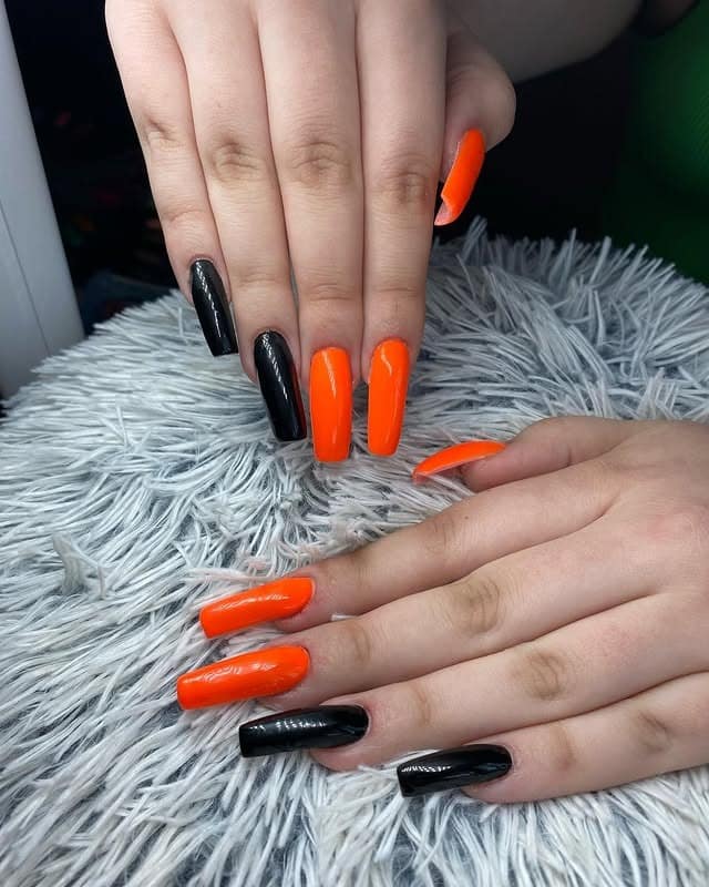 3. Classic Black and Orange Coffin Nails - black and orange nail ideas