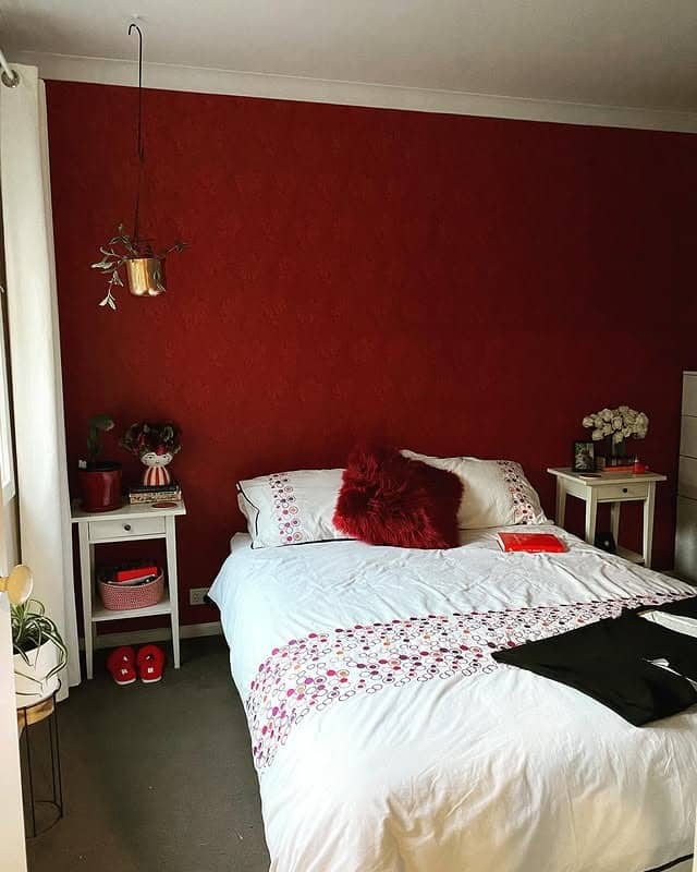 9. Cozy Red with Minimal Accents - red bedroom ideas