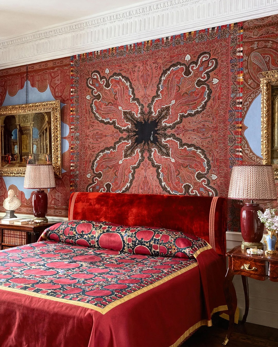15. Statement Red Bedroom with Patterned Wall Tapestry - red bedroom ideas