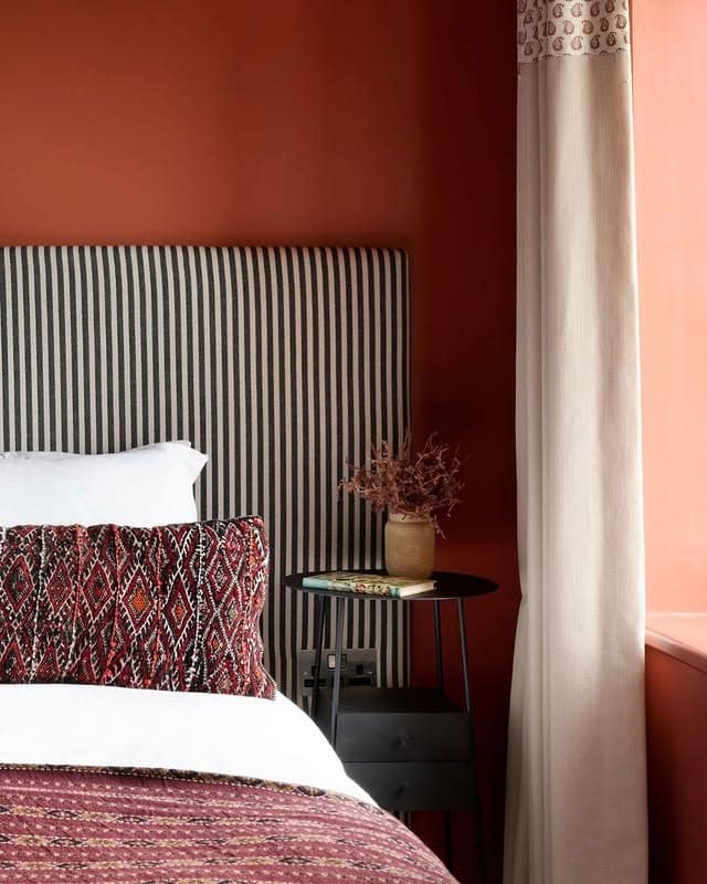 18. Earthy Red Bedroom with Textural Contrast - red bedroom ideas
