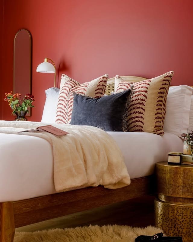 19. Refined Red Bedroom with Patterned Pillows - red bedroom ideas