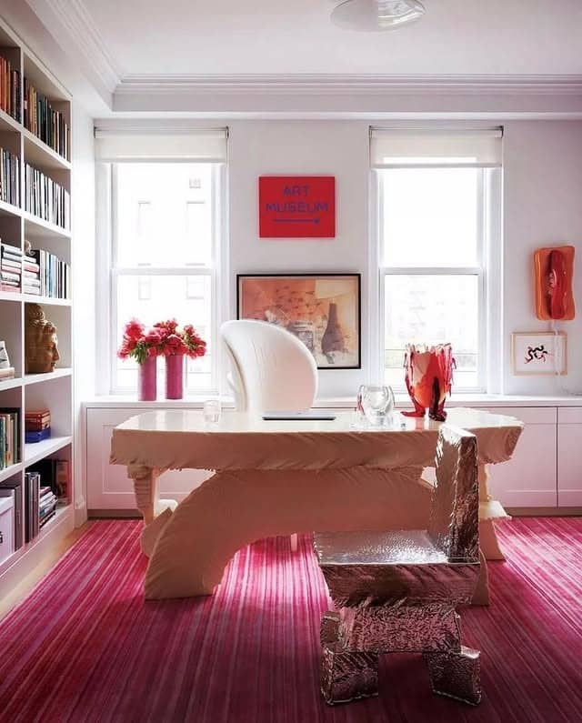 3. Art-Focused Pink Office with Sculptural Desk - pink office ideas