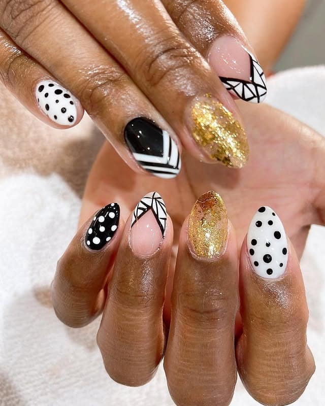 4. Mixed Black, White, and Gold Graphic Nails - black, white and gold nail ideas