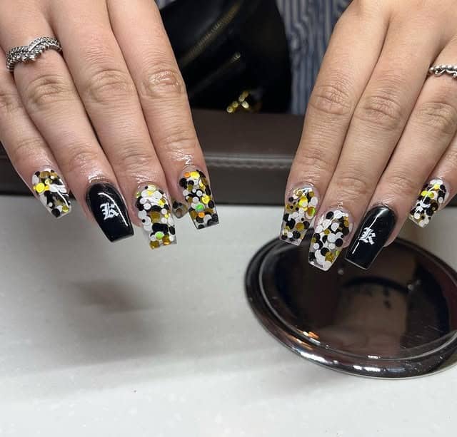 8. Clear and Black Nails with Gold Foil Mix - black, white and gold nail ideas